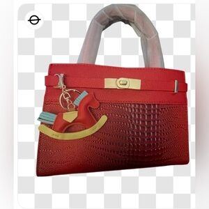 NEW-mini Kelly inspired
Red crocodile textured
Adjustable Shoulder strap handbag